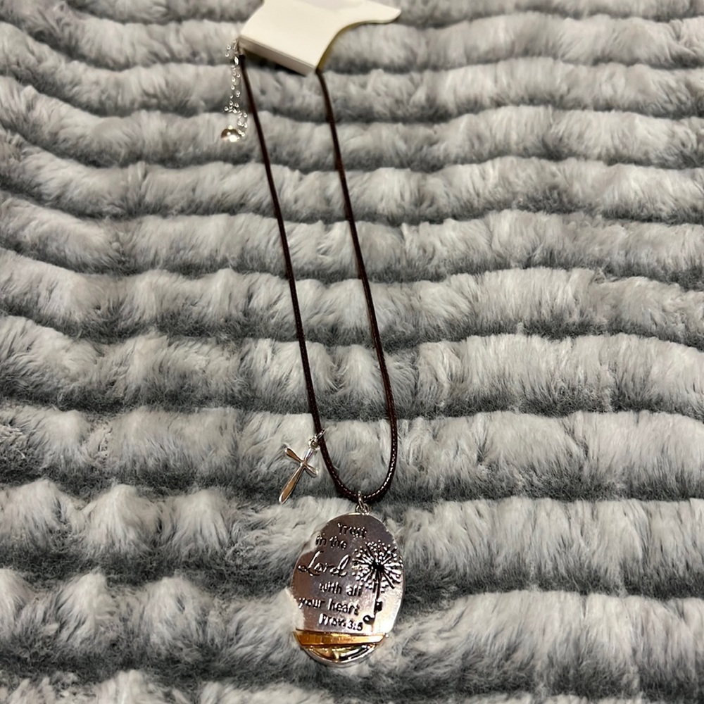 Necklace with polished leather strap, silver pendants.